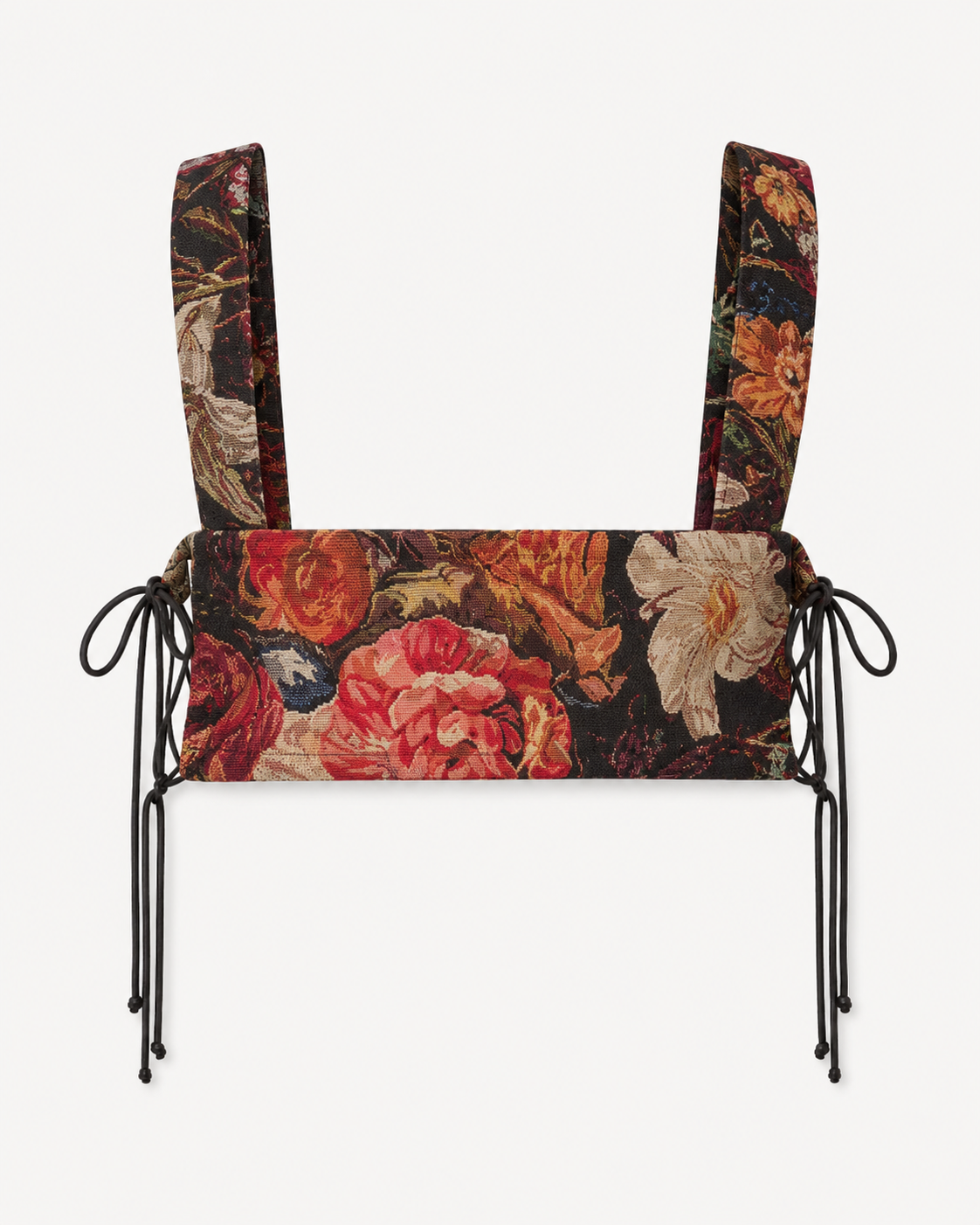 Back view of multicolour woven harness bib showing floral textile, shoulder straps and adjustable side ties.
