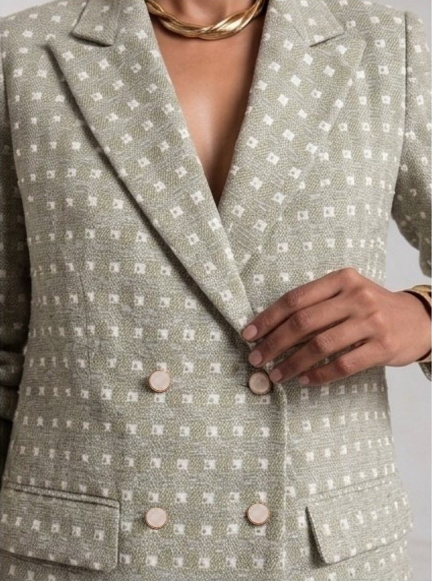 Close-up front view of light sage green Ping Me blazer showing lapels, embroidery and double-breasted buttons.