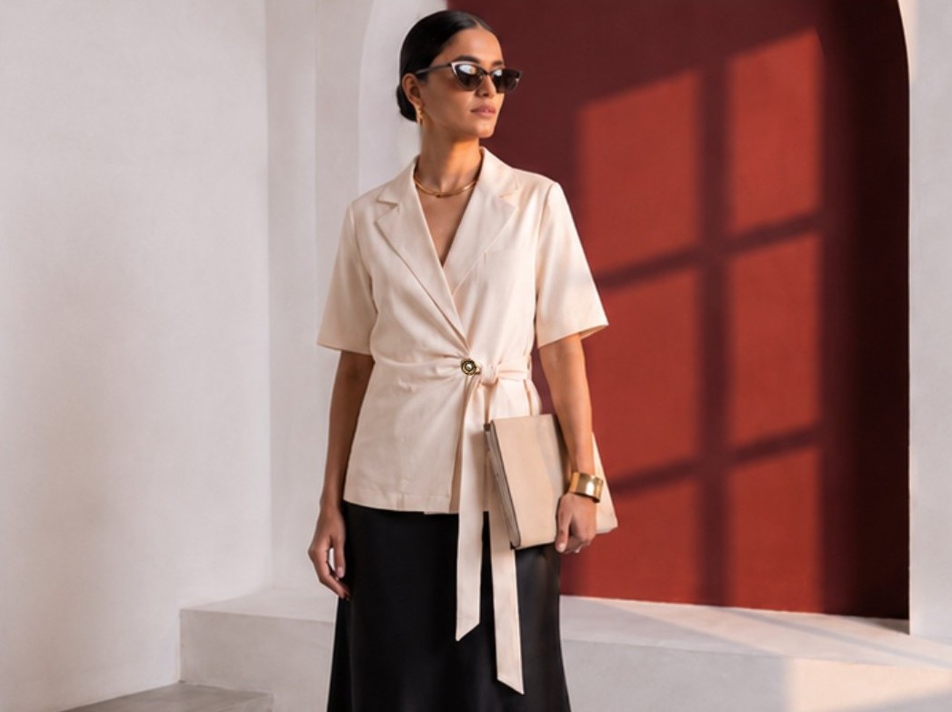 Cream Final Draft short-sleeve blazer with self-tie waist shown from the front.